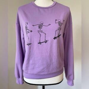 Skateboarding Skeletons sweatshirt in a size extra small